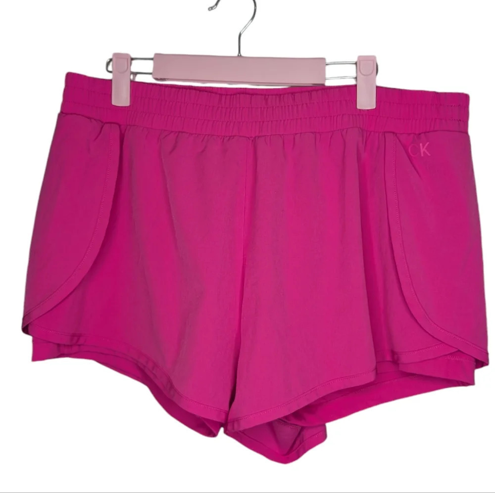 Calvin Klein 2 in 1 Running Dolphin Shape Athletic Shorts Hot Pink XL